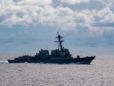 US Navy warship challenges China in South China Sea as US blasts Beijing's 'unlawful' claims and 'gangster tactics'